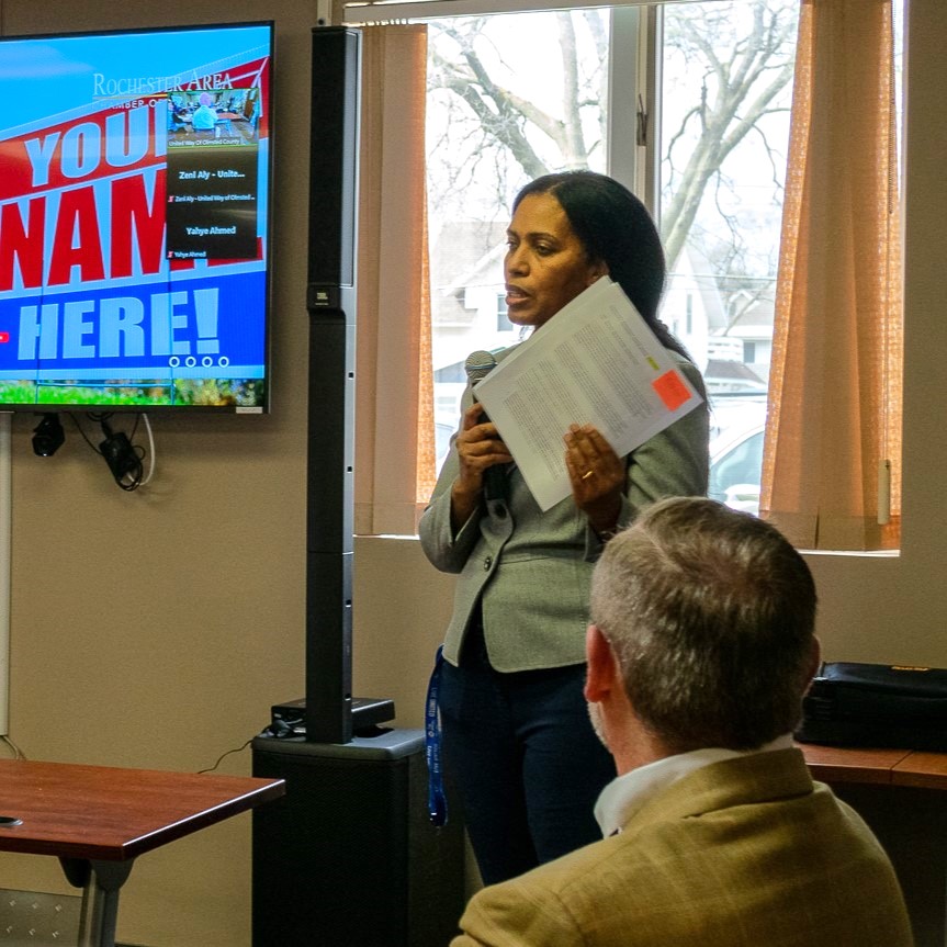 Photo of Zeni, and Ethiopian woman, speaking into a microphone