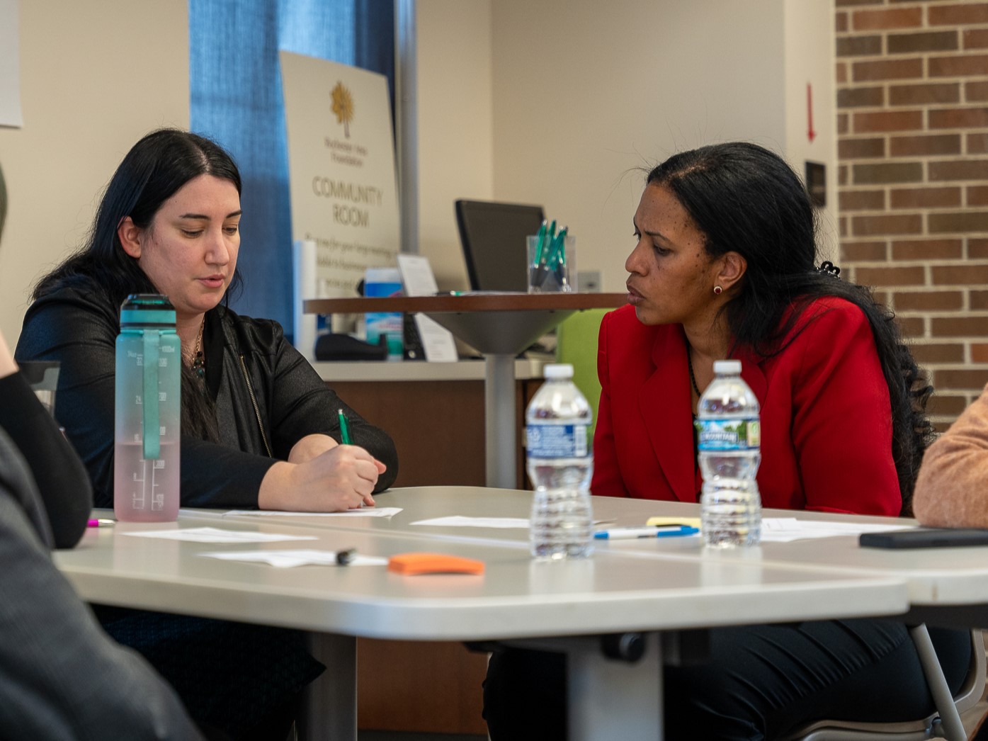 Photo of an Ethiopian woman and white woman in discussion